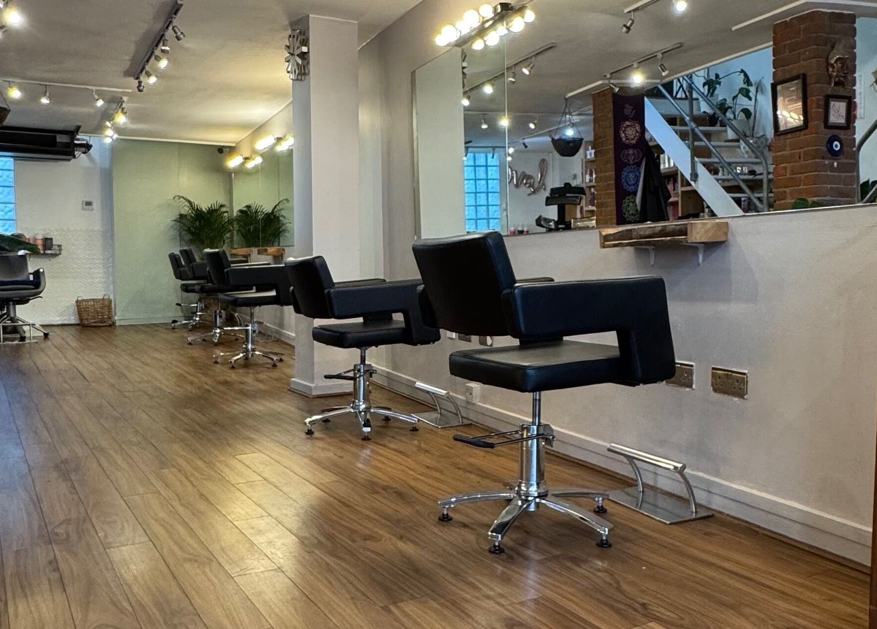 Elegant interior of The Studio by Marco Dias in Dublin, County Dublin, IE featuring sleek salon chairs and mirrors.