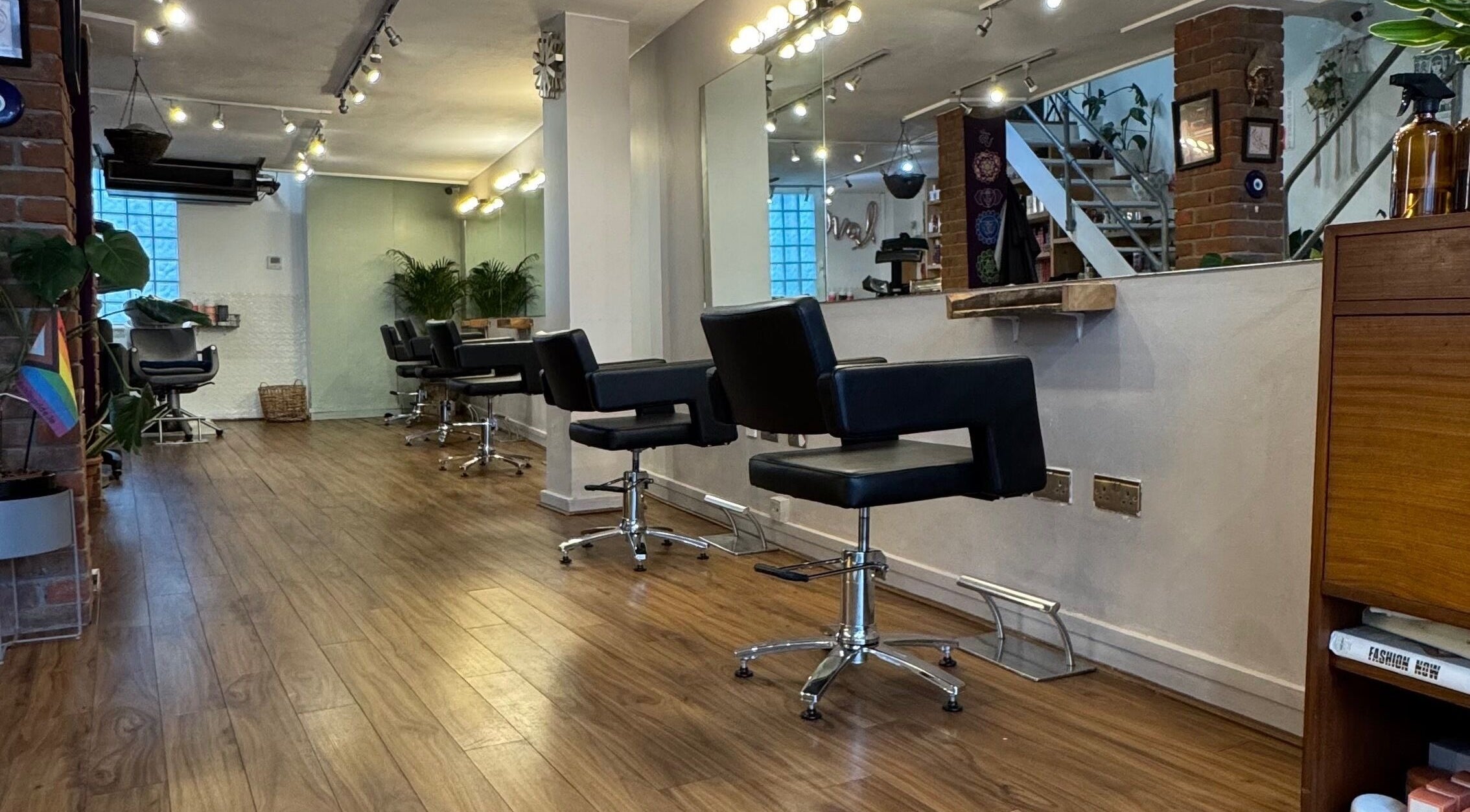 Elegant interior of The Studio by Marco Dias in Dublin, County Dublin, IE featuring sleek salon chairs and mirrors.