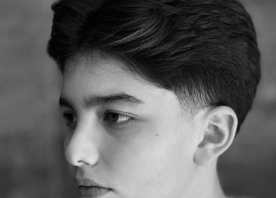 Youthful boy with stylish haircut at LE COUPE, Amman, Amman Governorate, JO.