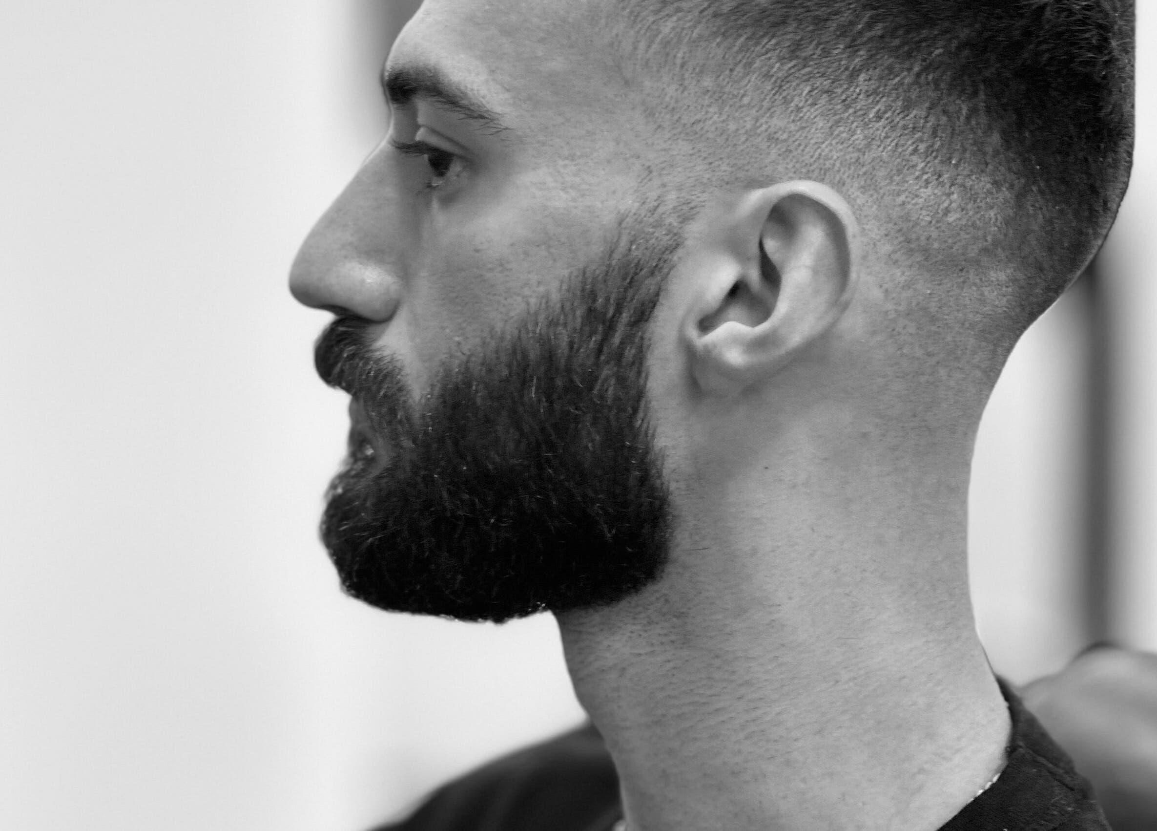 Side profile of a man with a styled beard at Le Coupe - لي كوب, Amman, Amman Governorate, JO.