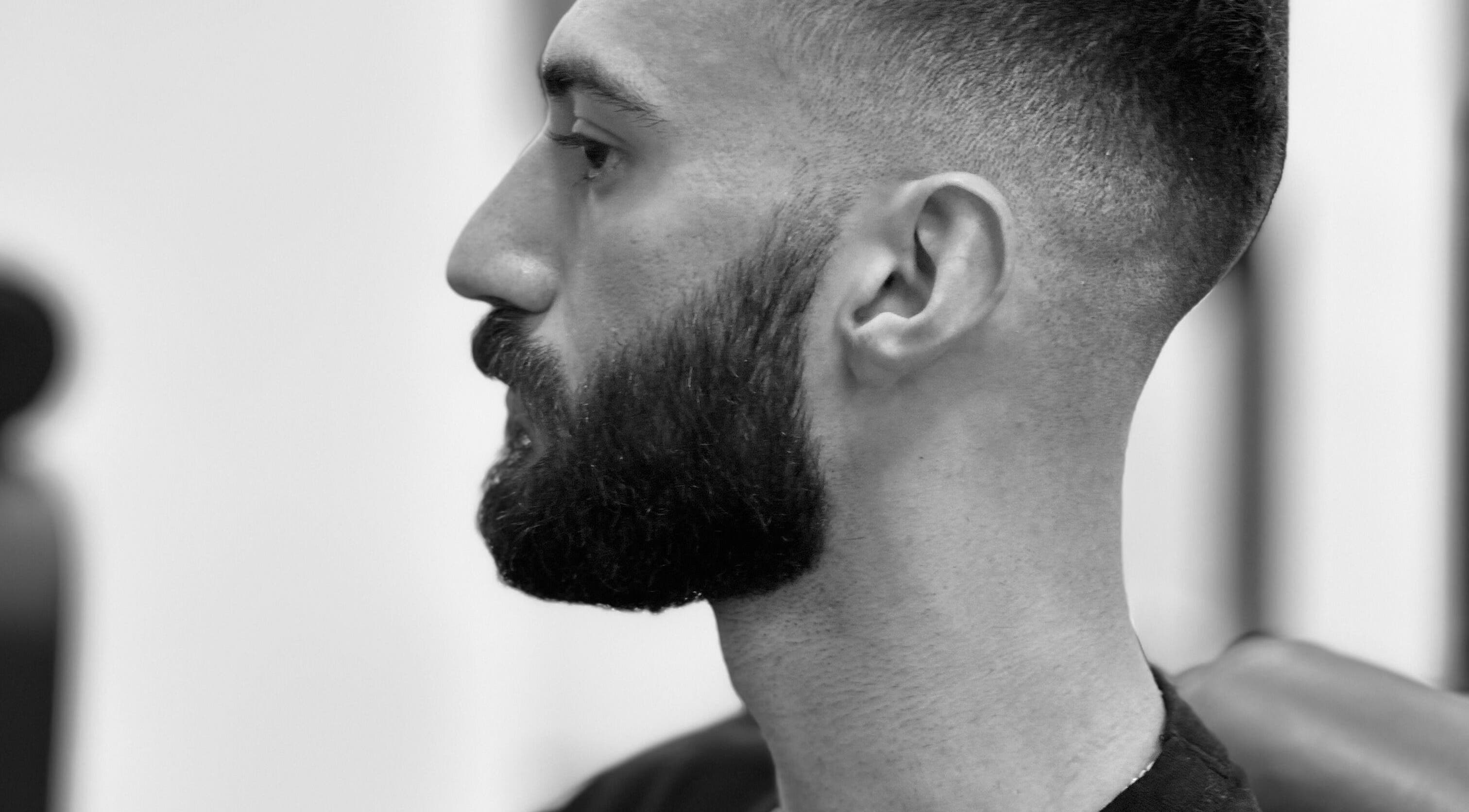 Side profile of a man with a styled beard at Le Coupe - لي كوب, Amman, Amman Governorate, JO.
