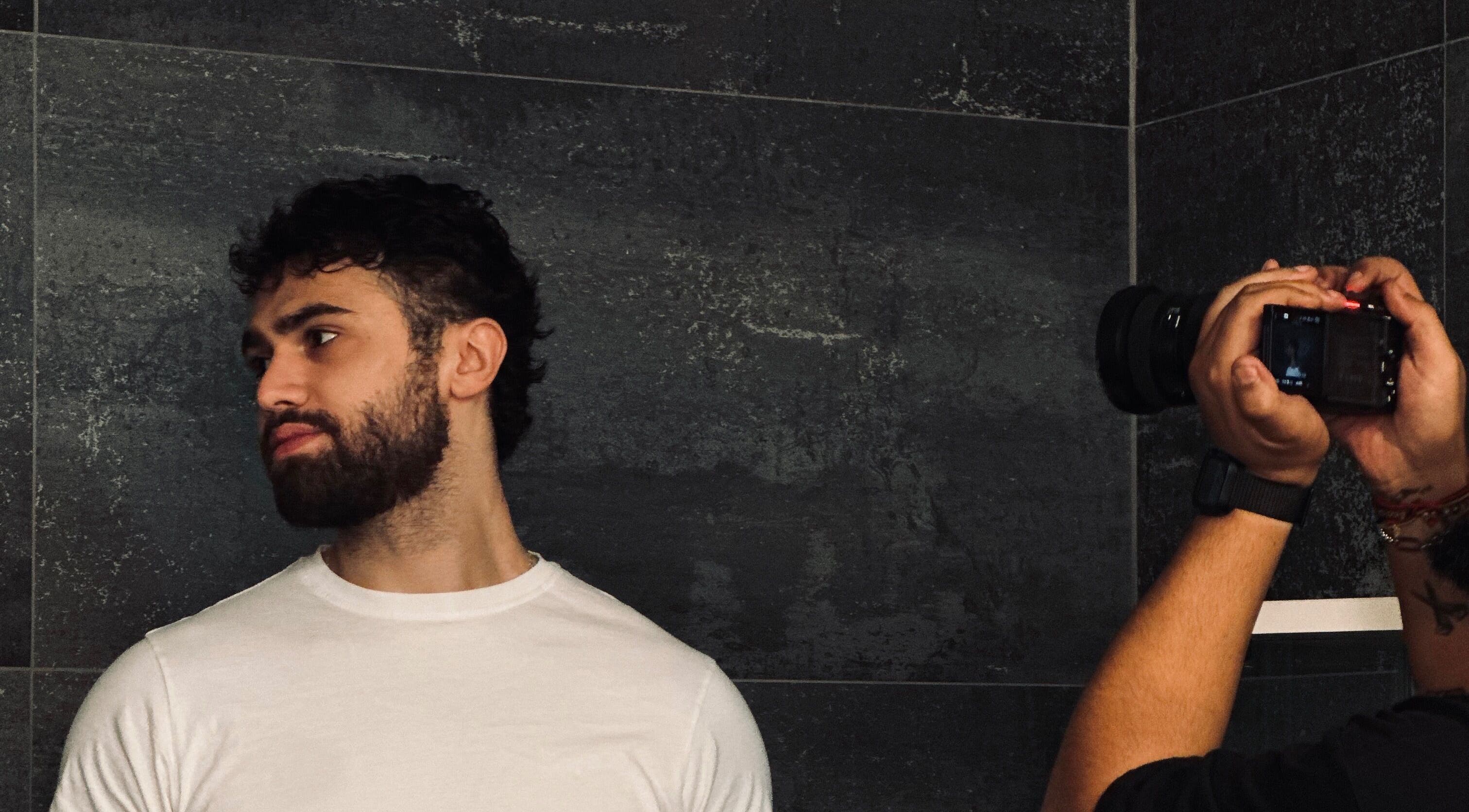 Man being photographed at Le Coupe - لي كوب, Amman, Amman Governorate, JO.