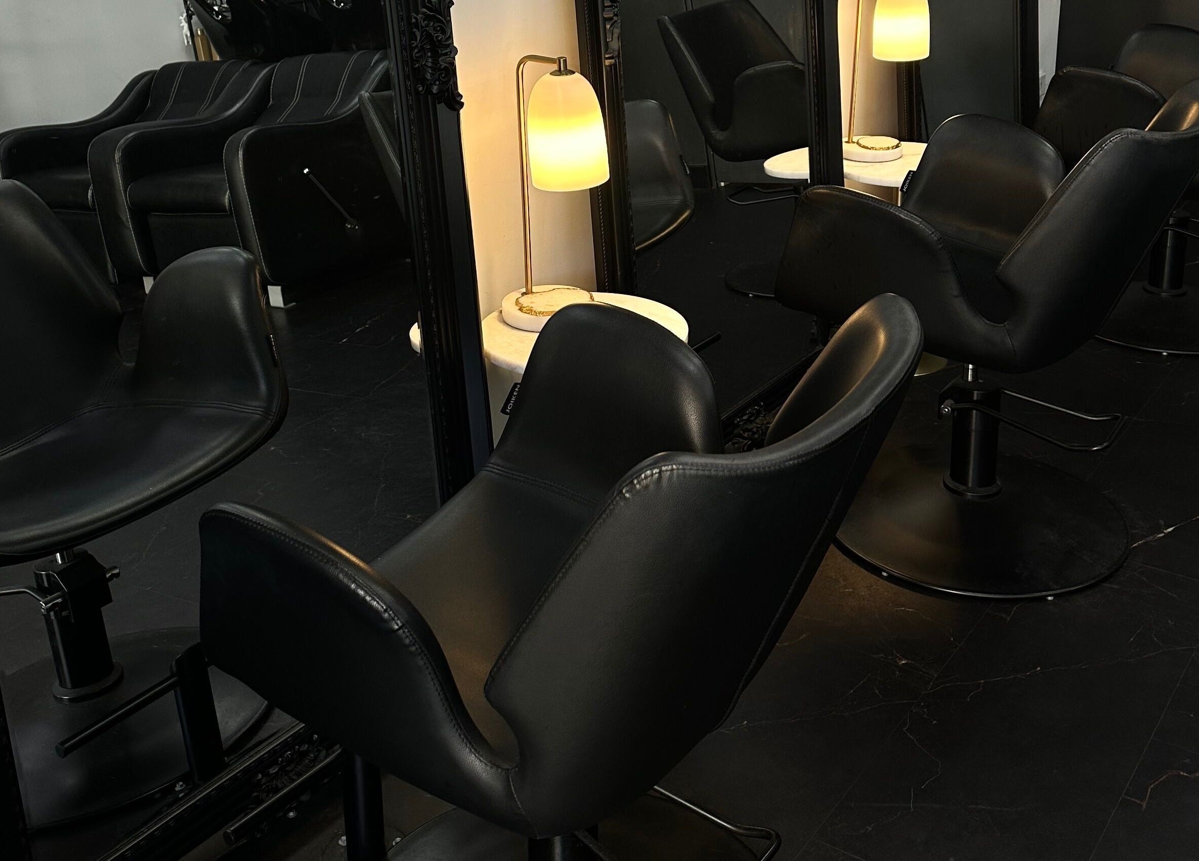 Elegant salon chairs at Hair Essentials at the Bay, Wentworth Point, New South Wales, AU.