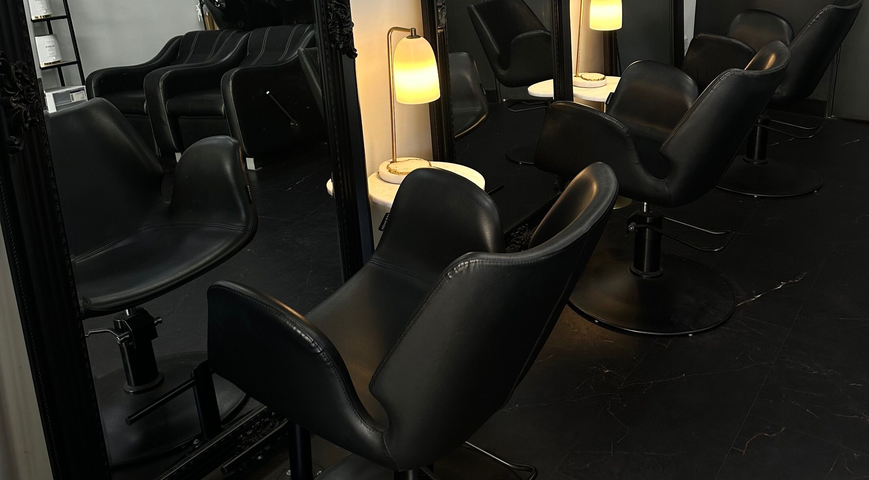 Elegant salon chairs at Hair Essentials at the Bay, Wentworth Point, New South Wales, AU.