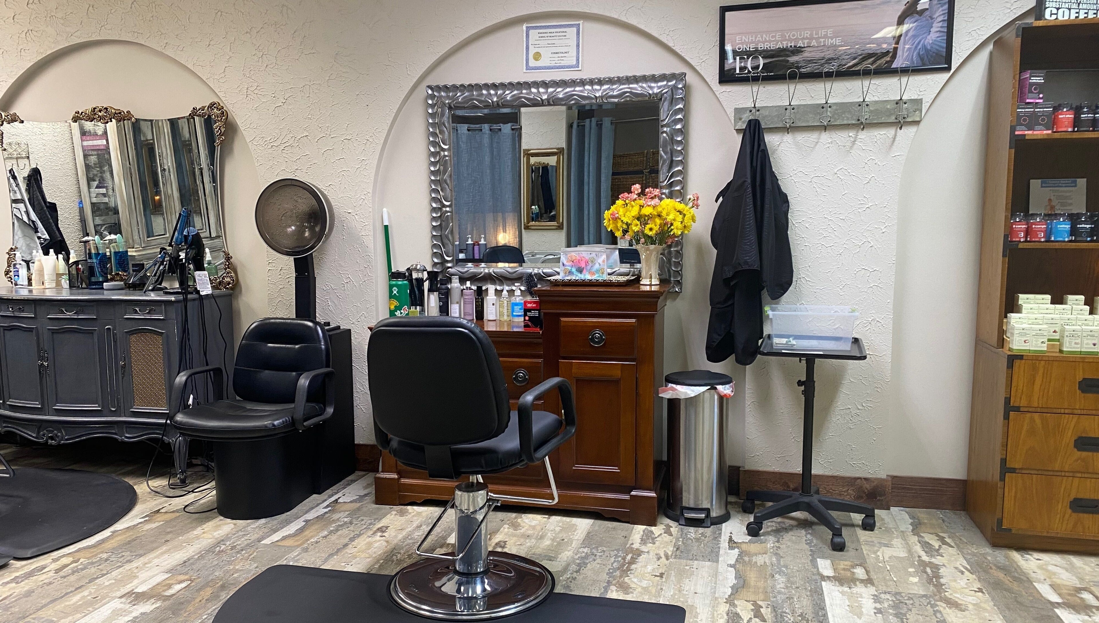 Elegant salon station with a mirror and chair at Palace of Wellness Salon and Spa, North Webster, Indiana, US.