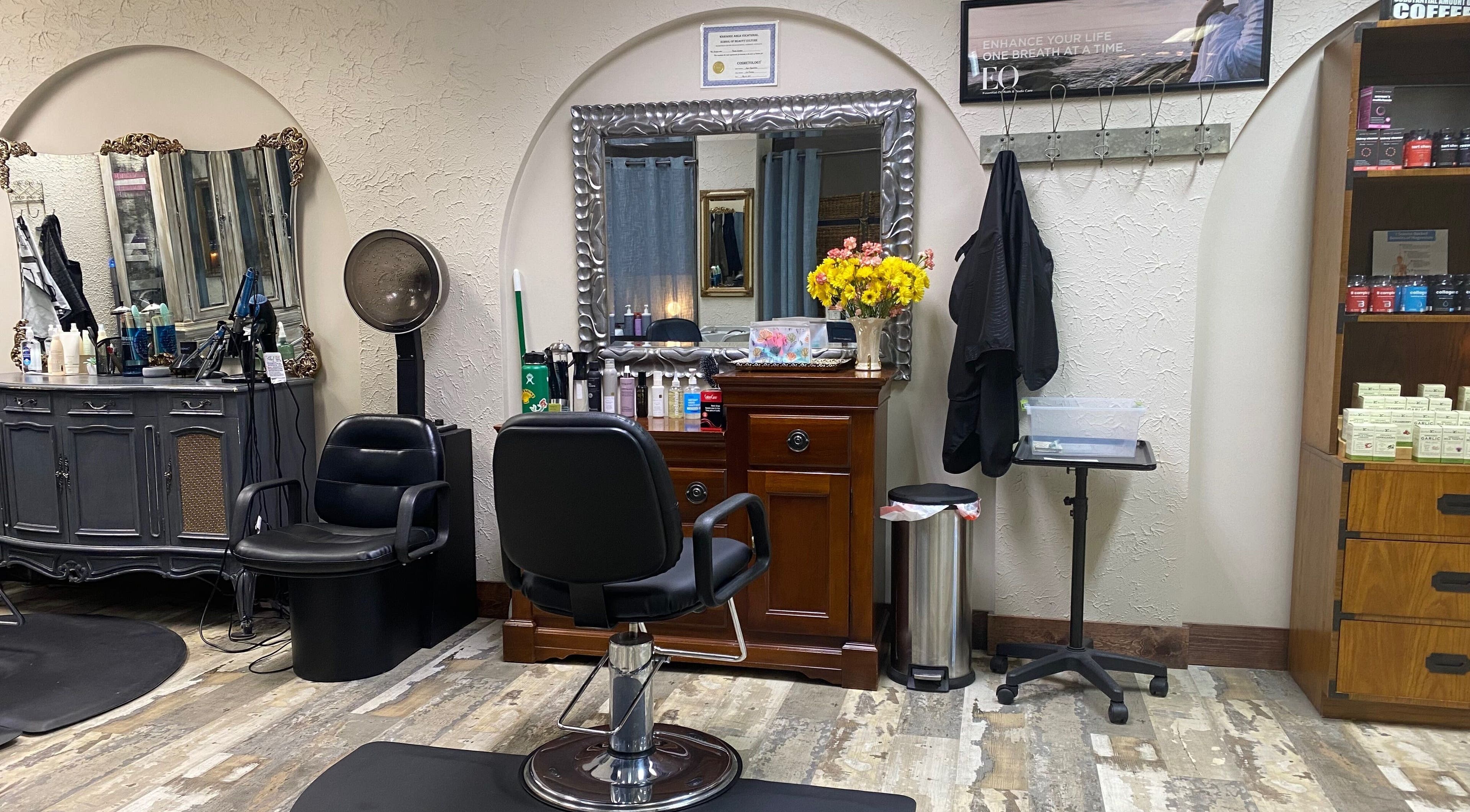 Elegant salon station with a mirror and chair at Palace of Wellness Salon and Spa, North Webster, Indiana, US.