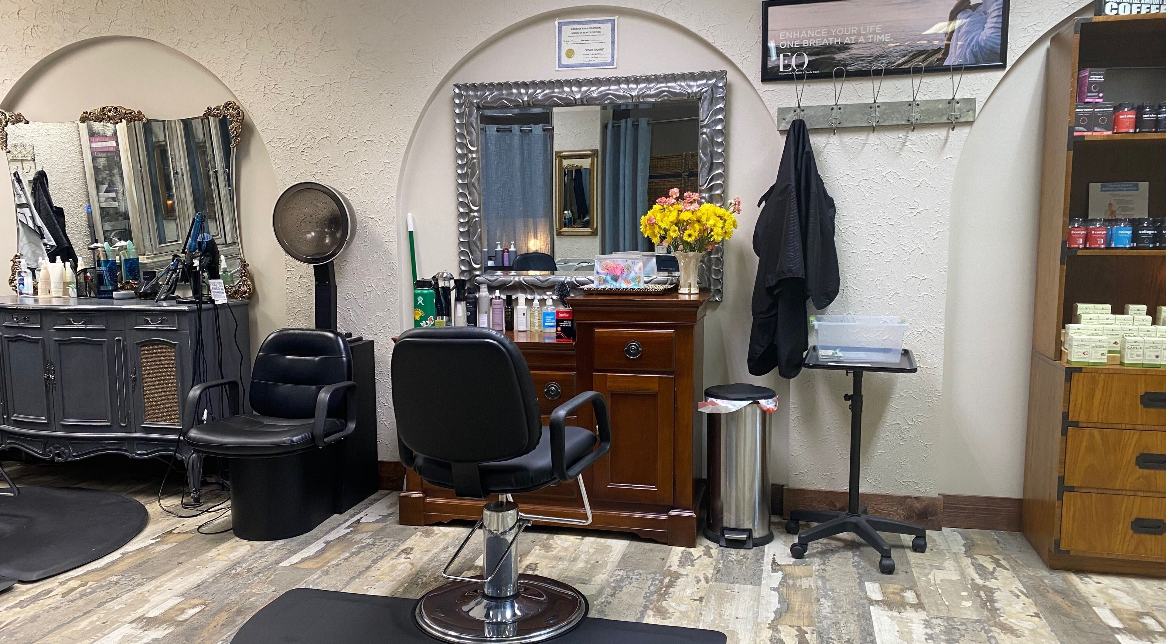 Elegant salon station with a mirror and chair at Palace of Wellness Salon and Spa, North Webster, Indiana, US.