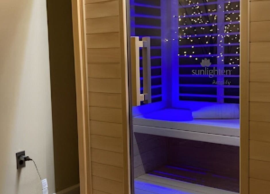 Peaceful sauna room with blue lighting at Palace of Wellness Salon and Spa, North Webster, Indiana, US.