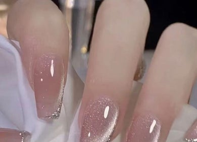 Elegant sparkling nails at Aria Nail, Massage & Head Spa in Fairfax, Virginia, US showcasing glitter design.