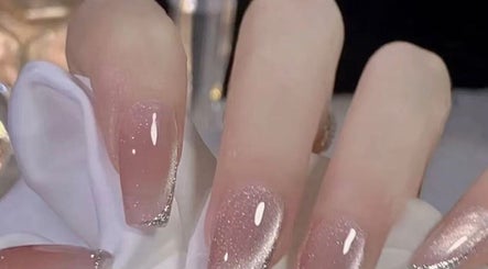 Elegant sparkling nails at Aria Nail, Massage & Head Spa in Fairfax, Virginia, US showcasing glitter design.
