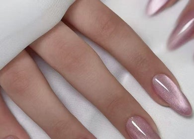 Pink manicured nails at Aria Nail, Massage & Head Spa, Fairfax, Virginia, US.