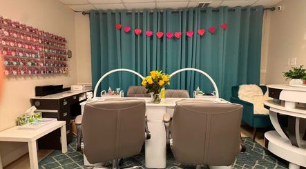 Elegant nail station at Aria Nail, Massage & Head Spa in Fairfax, Virginia, US with vibrant decor.
