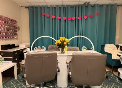 Elegant nail care area at Unique Nails & Head Spa, Fairfax, Virginia, US with cozy chairs and decor.