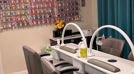 Unique Nails & Head Spa in Fairfax, Virginia, US offers a vibrant nail polish selection with stylish salon setup.