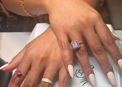 Stylish manicured hands at Unique Nails & Head Spa, Fairfax, Virginia, US, showcasing chic nail design.