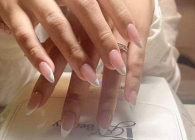 Close-up of elegant French manicured nails at Unique Nails & Head Spa, Fairfax, Virginia, US.