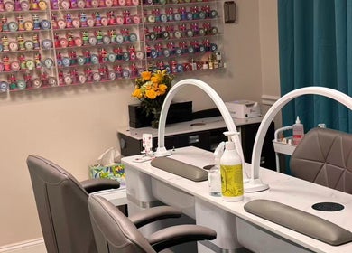 Nail salon table with polish display at Unique Nails & Head Spa in Fairfax, Virginia, US.