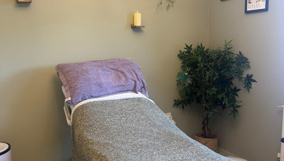 Comfortable treatment room at Gentle Waves Healing, Culleens, County Sligo, IE, featuring a cozy bed and relaxed decor.