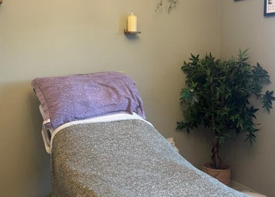 Comfortable treatment room at Gentle Waves Healing, Culleens, County Sligo, IE, featuring a cozy bed and relaxed decor.