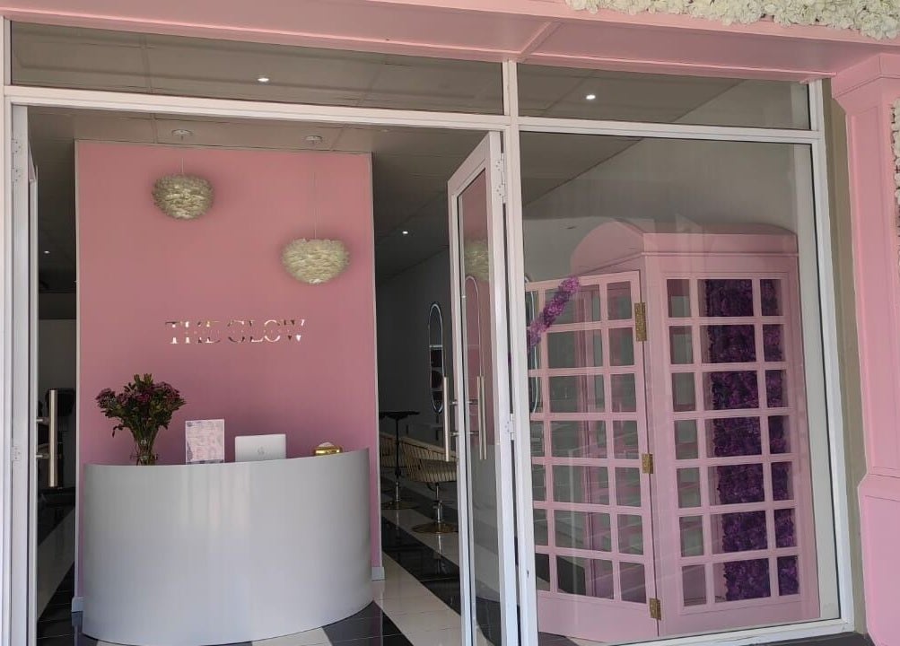 The elegant entrance of The Glow Boutique Salon in Hillcrest, Kwazulu-natal, ZA, showcasing modern decor.