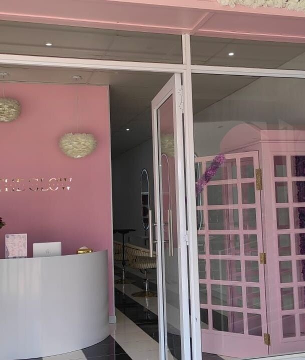 The elegant entrance of The Glow Boutique Salon in Hillcrest, Kwazulu-natal, ZA, showcasing modern decor.