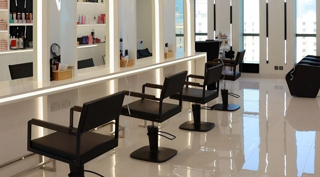 Modern salon setup at Extreme Beauty Salon, Abu Dhabi, AE with chic chairs and illuminated mirrors.