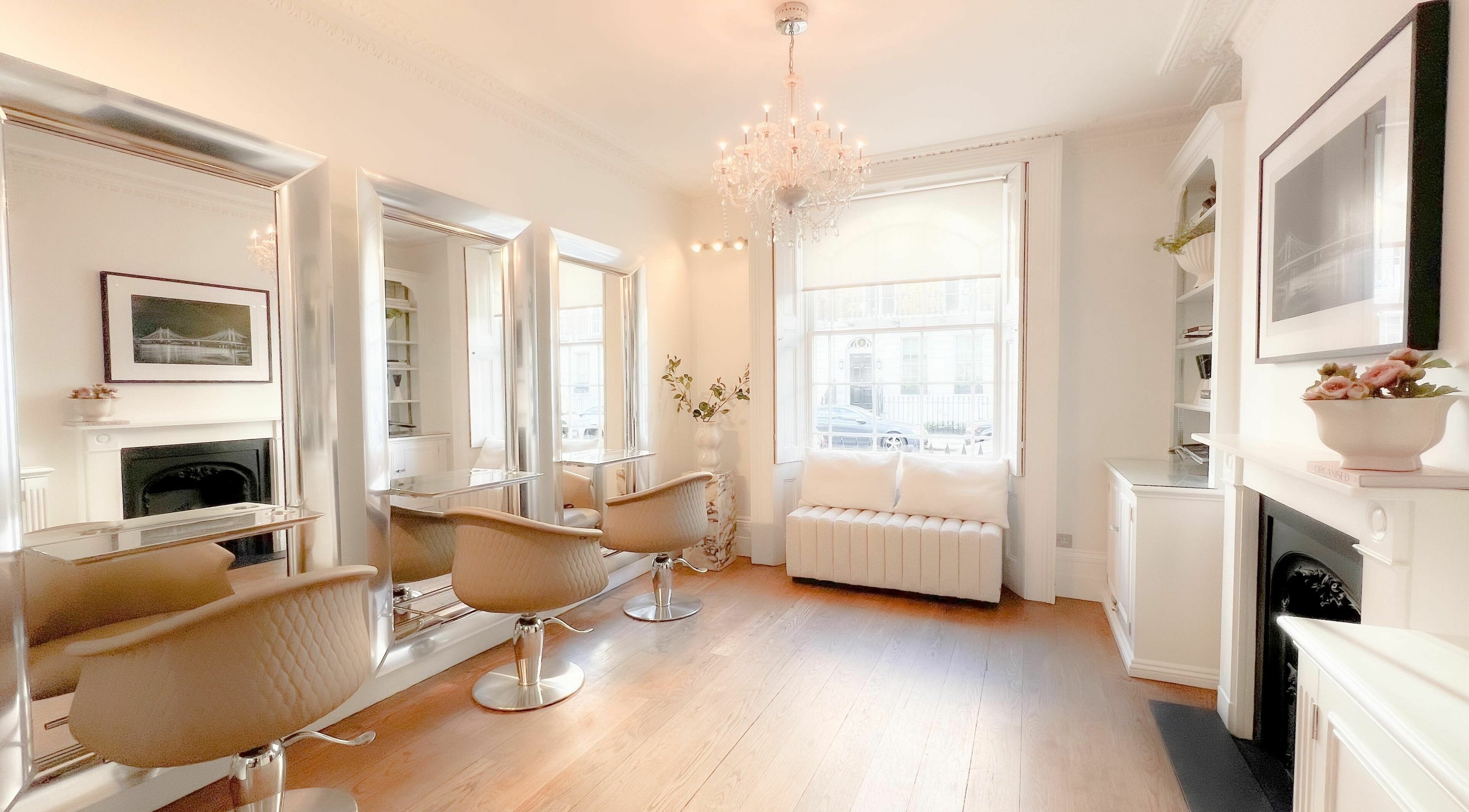 Sophisticated salon interior at Fox & Vamp, London, England, GB, featuring stylish mirrors and chic seating.