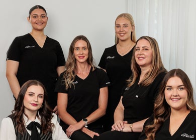 Blush Brows + Beauty staff smiling at North Mackay, Queensland, AU venue, showcasing teamwork and professionalism.