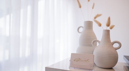 Elegant vases at Blush Brows + Beauty in North Mackay, Queensland, AU create a tranquil ambiance.