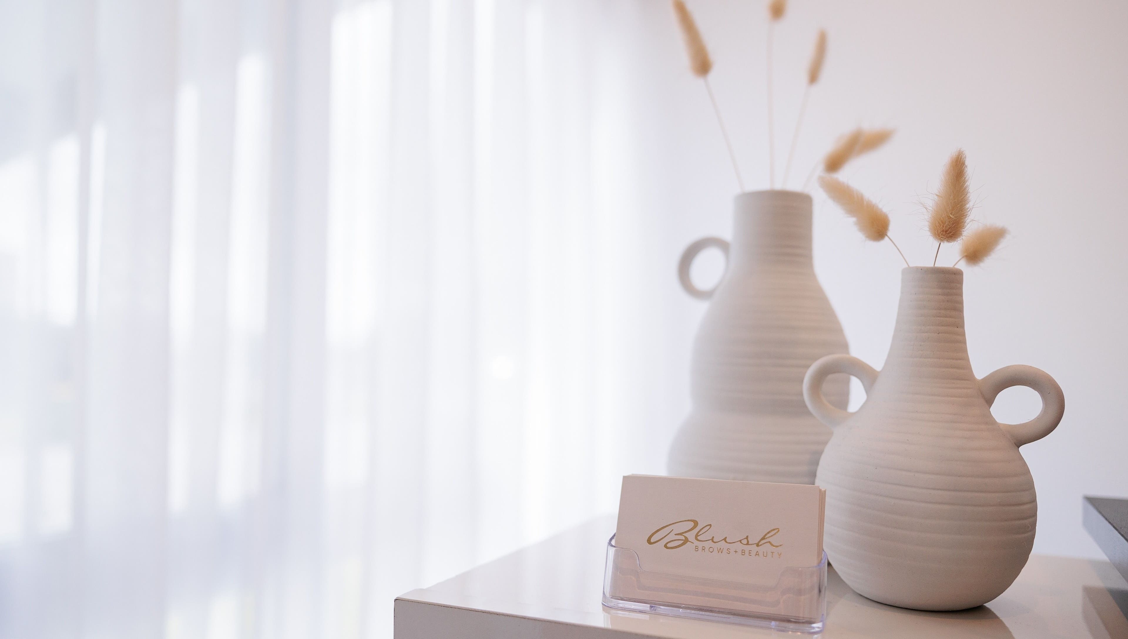 Elegant ceramic vases on display at Blush Brows and Beauty, North Mackay, Queensland, AU.