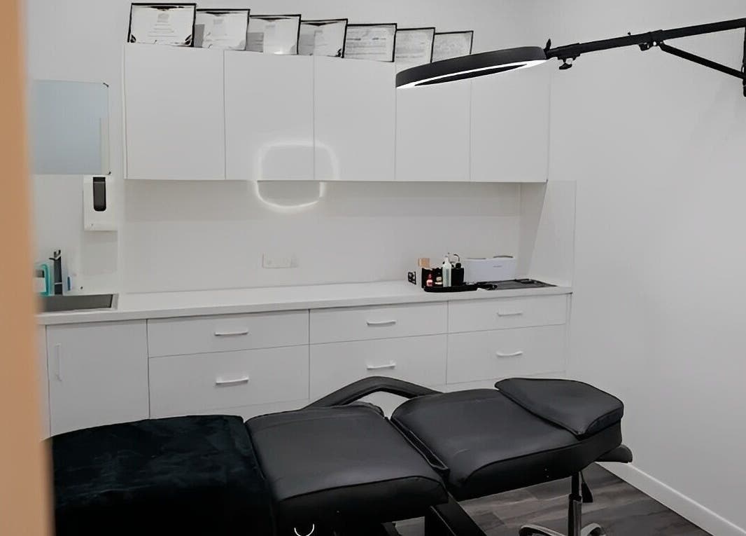 Modern treatment room at Blush Brows + Beauty in North Mackay, Queensland, AU with sleek white cabinetry.