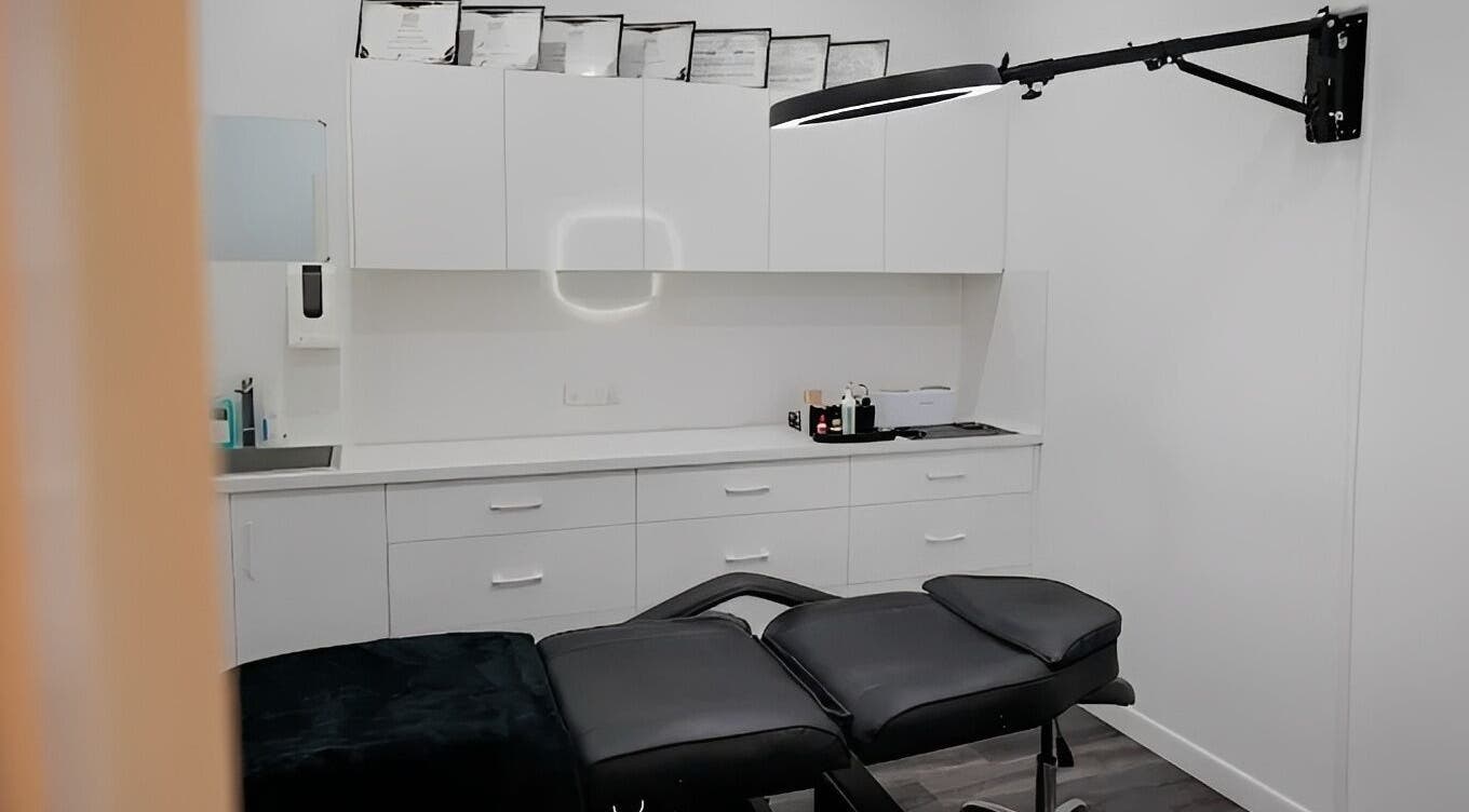 Modern treatment room at Blush Brows + Beauty in North Mackay, Queensland, AU with sleek white cabinetry.