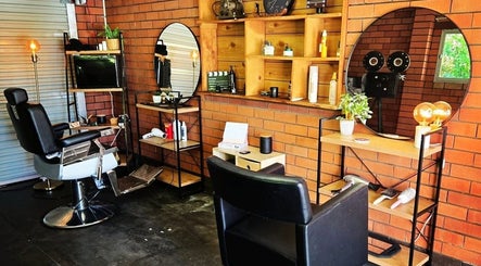 Scissors Hair Studio in Hamilton Hill, Western Australia, features a stylish, vintage-themed interior with barber chairs.