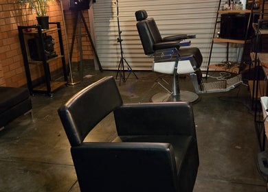 Stylish interior of Scissors Hair Studio in Hamilton Hill, Western Australia, AU, featuring modern chairs and decor.