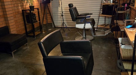 Stylish interior of Scissors Hair Studio in Hamilton Hill, Western Australia, AU, featuring modern chairs and decor.