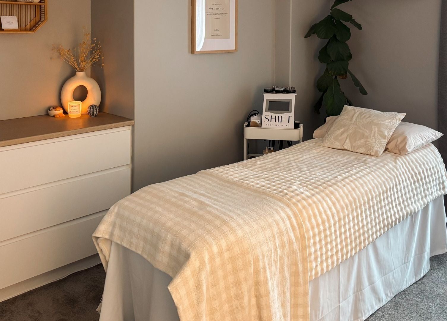 Cozy treatment room at SHIFT Body Sculpting, Waikiki, Western Australia, AU, featuring warm lighting and decor.