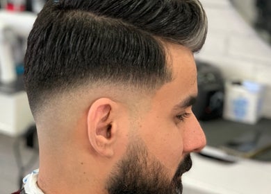 Close-up of a tapered haircut at T&E Barber, London, England, GB, showcasing precise styling.