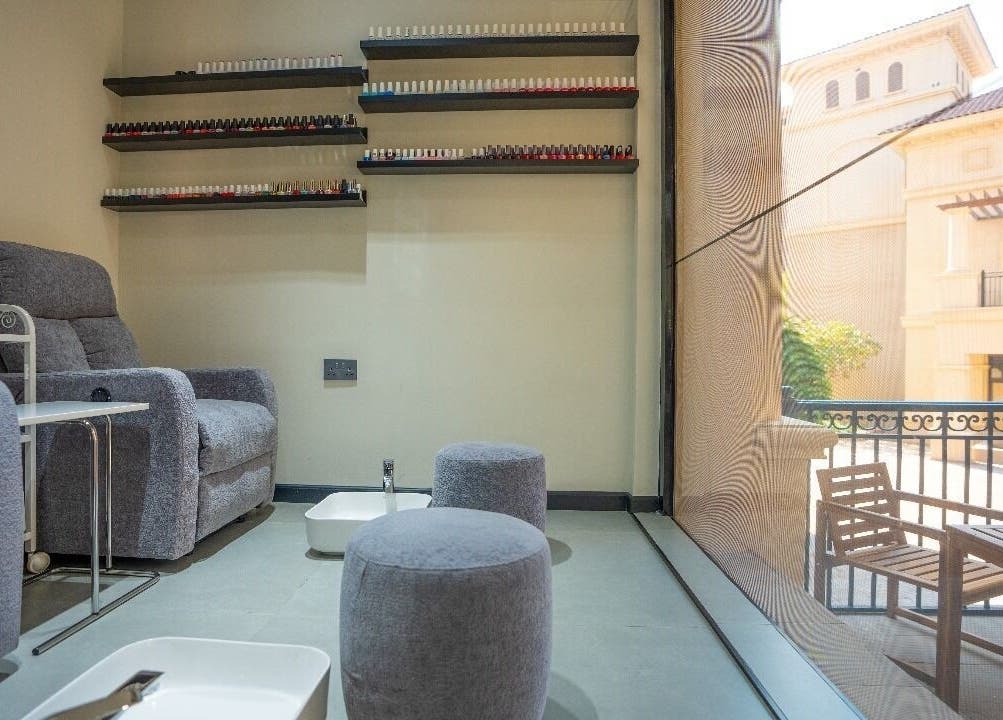 Comfortable pedicure chairs at Mike's Beauty Lounge, أبو ظبي, أبو ظبي, AE, with a view of the patio.