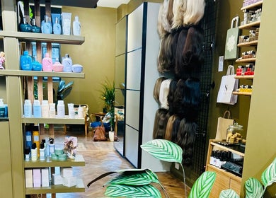 Matthew Morris with Peluka Salon, Southend on Sea, England, features an elegant product display wall.