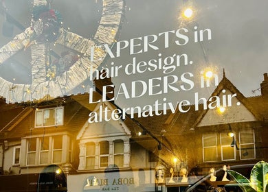 Shopfront of Matthew Morris with Peluka Salon in Southend on Sea, England showcasing hair design expertise.
