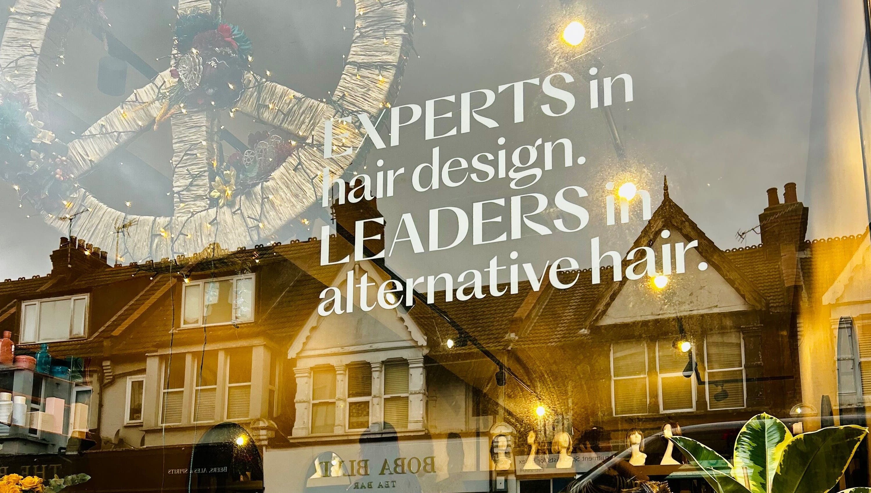 Shopfront of Matthew Morris with Peluka Salon in Southend on Sea, showcasing hair design expertise.