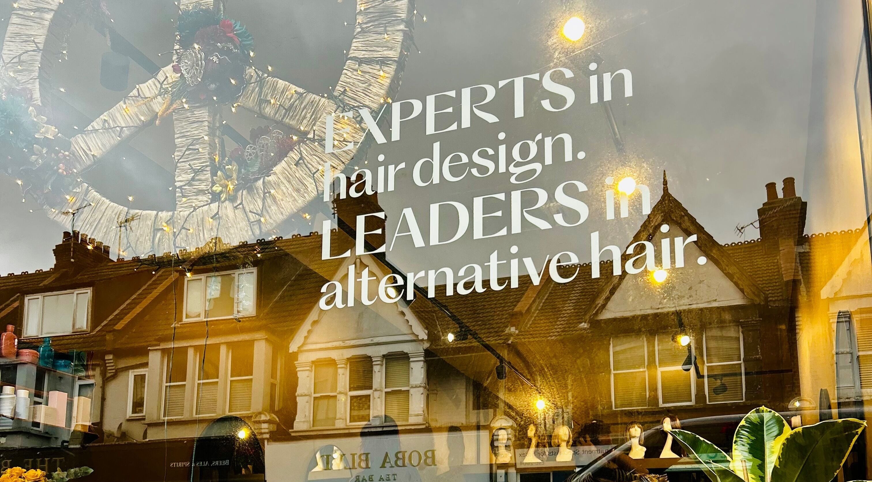 Shopfront of Matthew Morris with Peluka Salon in Southend on Sea, showcasing hair design expertise.