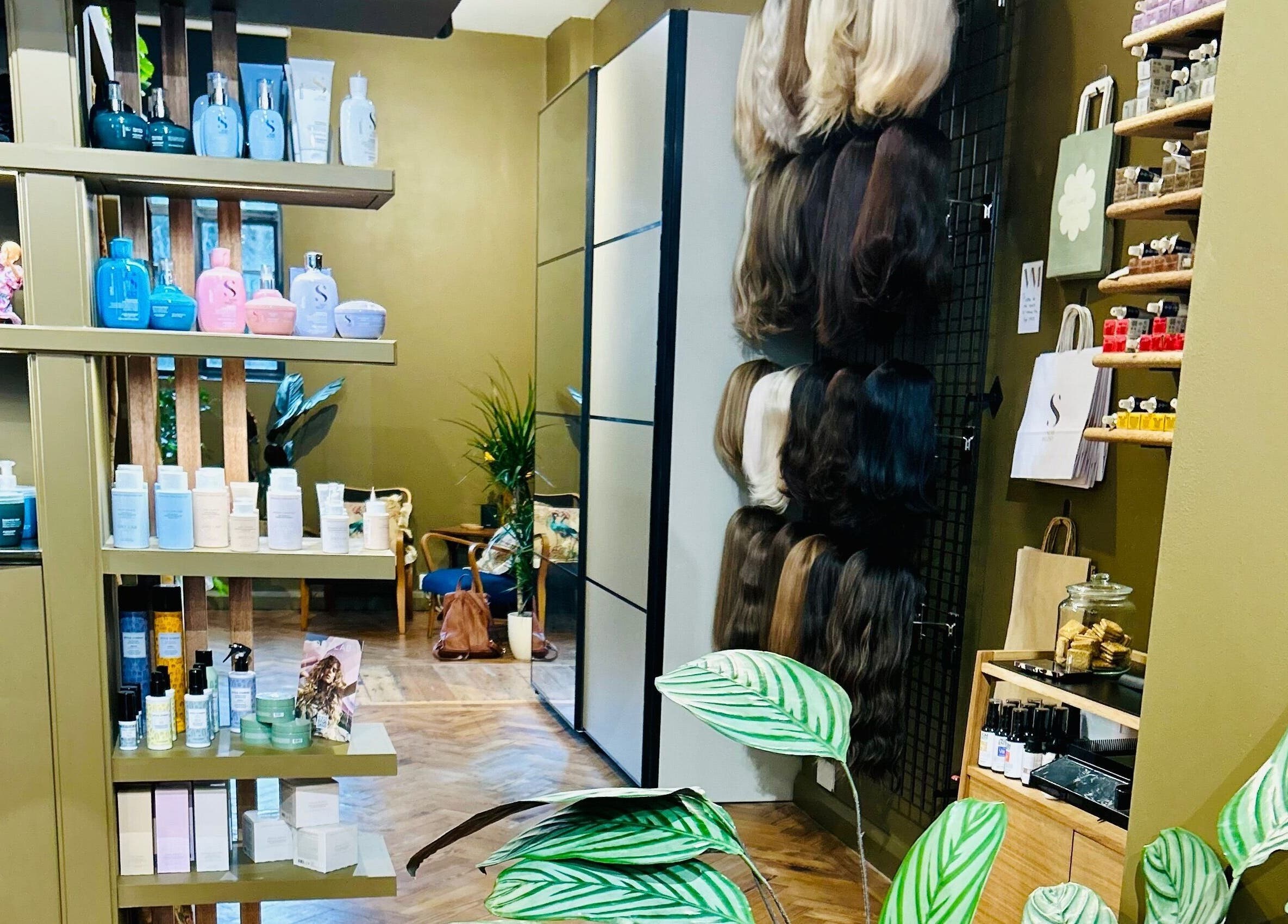 Interior of Matthew Morris with Peluka Salon, showcasing products and wigs in Southend on Sea, England, GB.