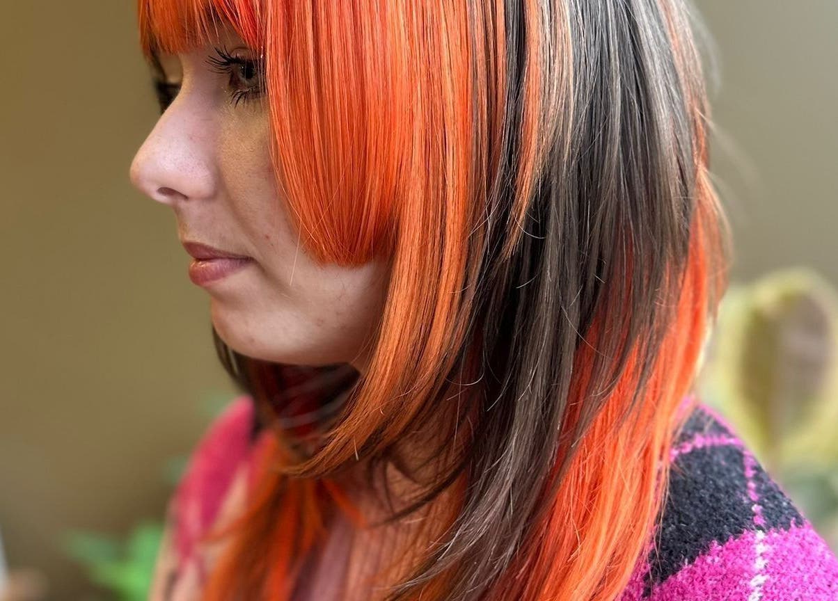 Vibrant orange and black hairstyle at Matthew Morris with Peluka Salon, Southend on Sea, England, GB.