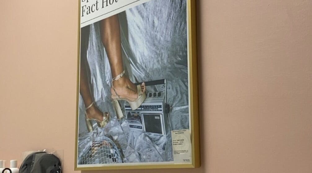 Stylish wall art at Rare Hearts Artistry Spray Tans, Portland, Oregon, US featuring heels and retro vibes.