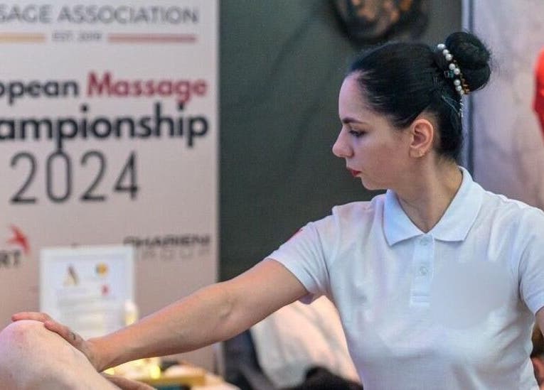 Therapist at Massage & Beauty By Miky in-naxxar, MT, performing a massage at European Championship 2024.