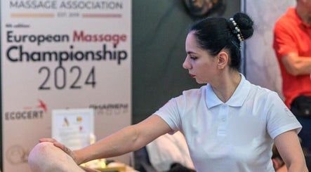 Therapist at Massage & Beauty By Miky in-naxxar, MT, performing a massage at European Championship 2024.