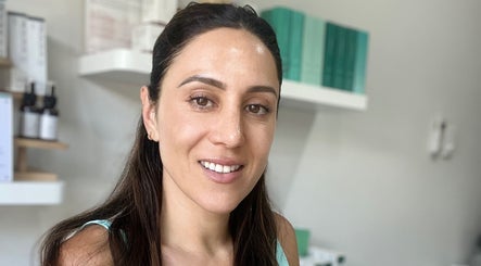 Smiling woman at Healthy Skin Lab, Trinity Beach, Queensland, AU showcasing vibrant skincare results.