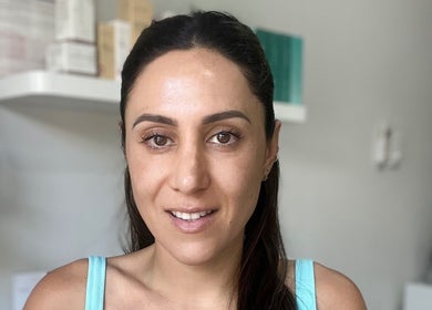 Smiling client at Healthy Skin Lab, Trinity Beach, Queensland, AU, enjoying beauty treatment.