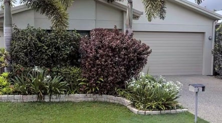 Beautiful facade of Healthy Skin Lab at Trinity Beach, Queensland, AU, surrounded by lush greenery.